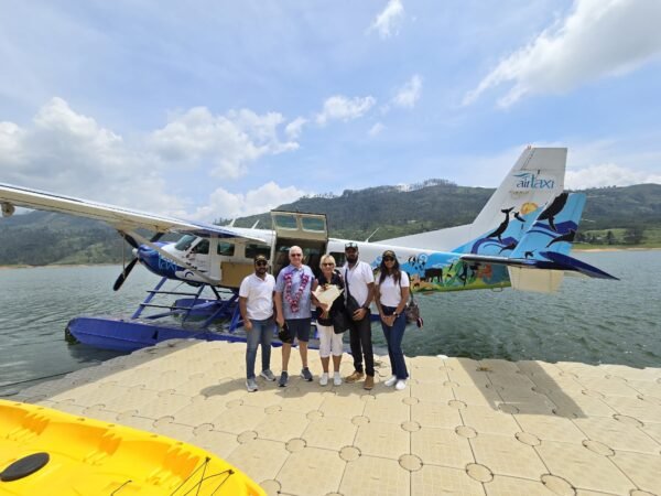 Our clients welcomed by the Luxurious Lanka team beside a seaplane at Castlereagh Lake.