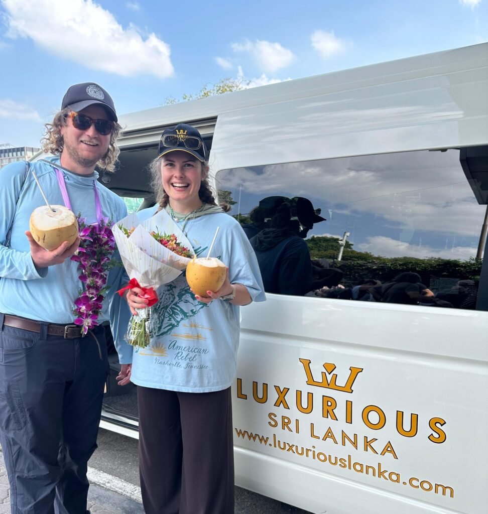 Our clients warmly welcomed beside a Luxurious Lanka vehicle.