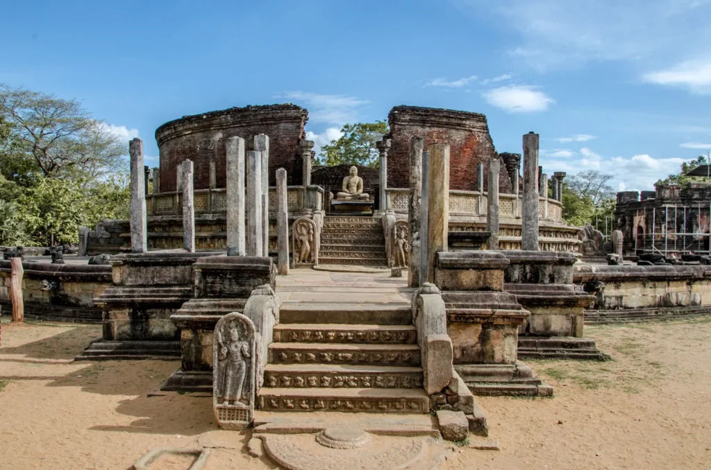 Ancient Vatadage ruins with a seated Buddha statue in Polonnaruwa, Sri Lanka.