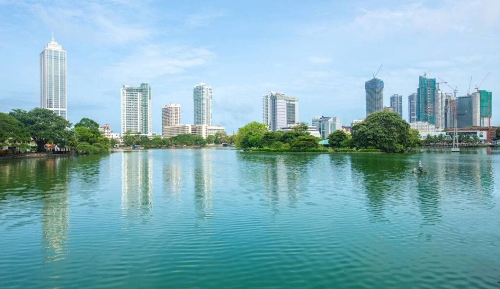 Beira Lake with Colombo’s modern skyline reflected across the water.