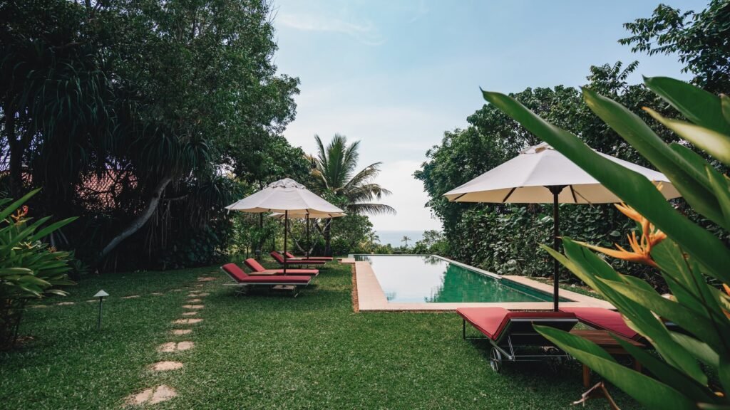Infinity pool surrounded by tropical gardens at Cape Weligama.