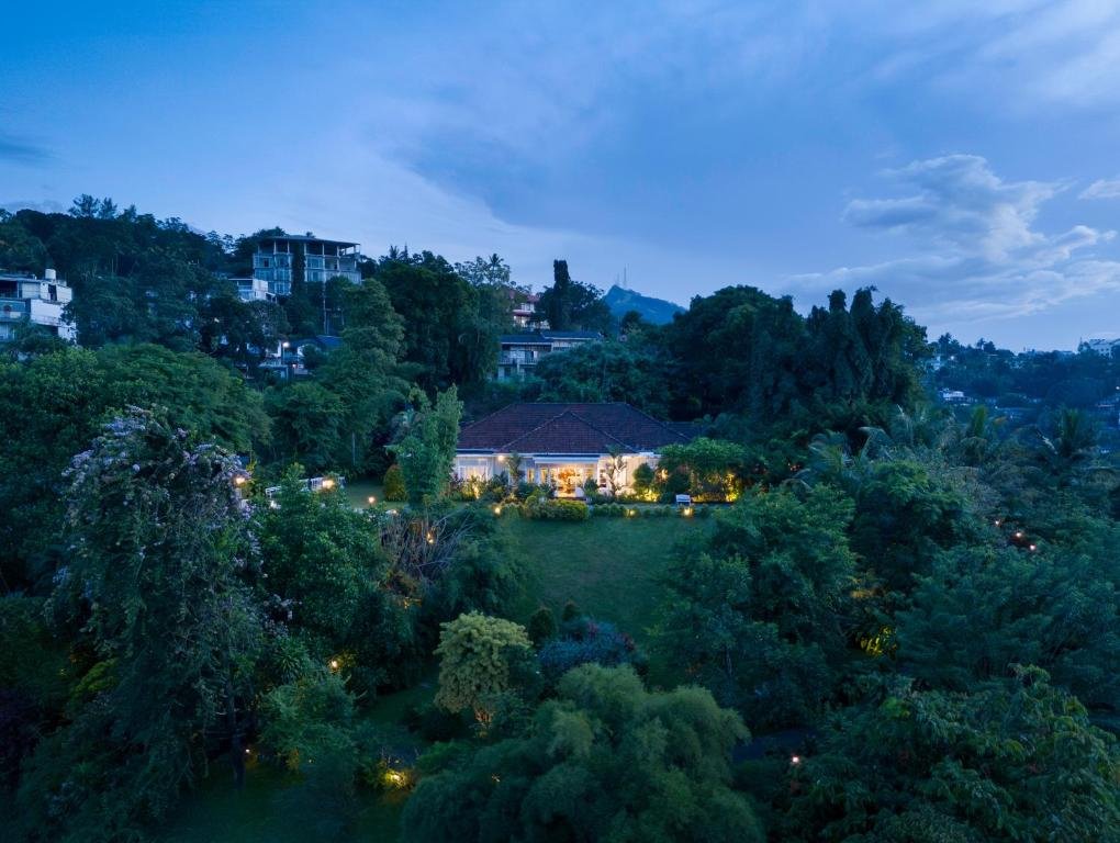Castle Hill Bungalow surrounded by lush greenery in Kandy, Sri Lanka.