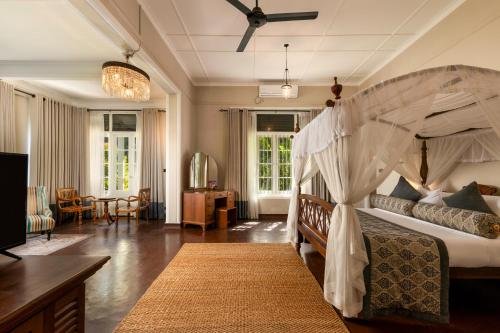 Elegant bedroom with a four-poster bed at Castle Hill, Kandy.