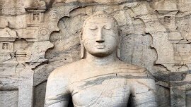 Seated Buddha statue carved from granite at Gal Vihara in Polonnaruwa.