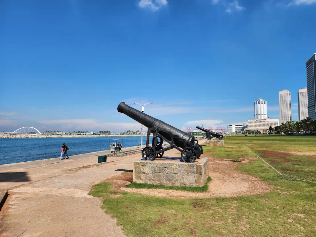 Historic cannons overlooking the ocean at Galle Face Green in Colombo.