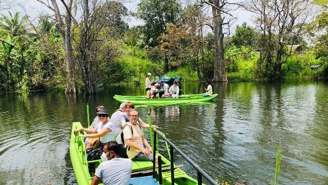 Tourists enjoying a catamaran ride in Hiriwaduna, Sri Lanka.