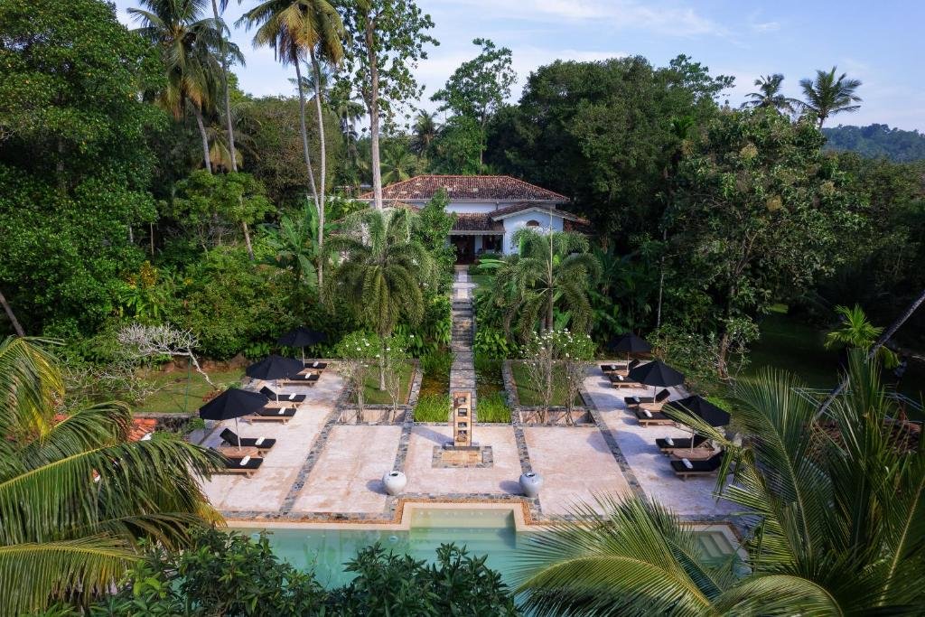 Aerial view of JH Villa Thalpe with a swimming pool and tropical gardens.