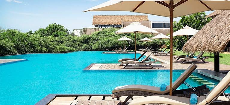 Swimming pool with sun loungers at Jetwing Yala, Sri Lanka.