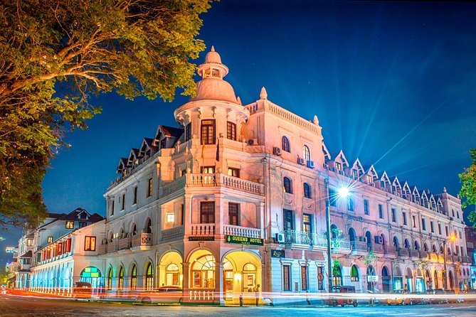 Illuminated colonial architecture in Kandy, Sri Lanka, at night.