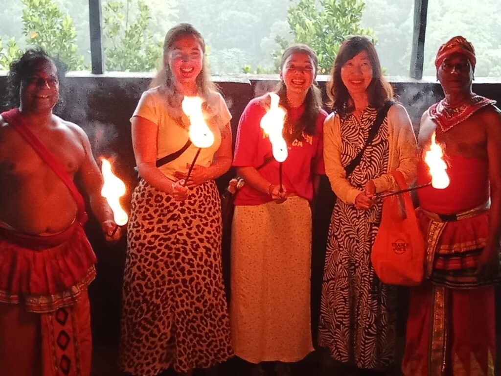 Our clients posing with traditional Kandyan fire dancers in Kandy.