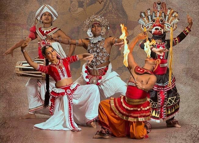 Traditional Kandyan dancers and fire performers in colourful costumes.