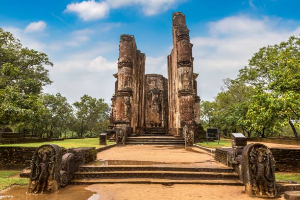 Entrance to the ancient Lankatilaka Image House in Polonnaruwa, framed by towering brick walls.