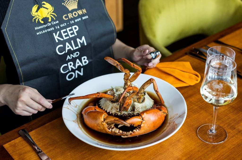 Diner enjoying a signature Sri Lankan crab dish at Ministry of Crab.