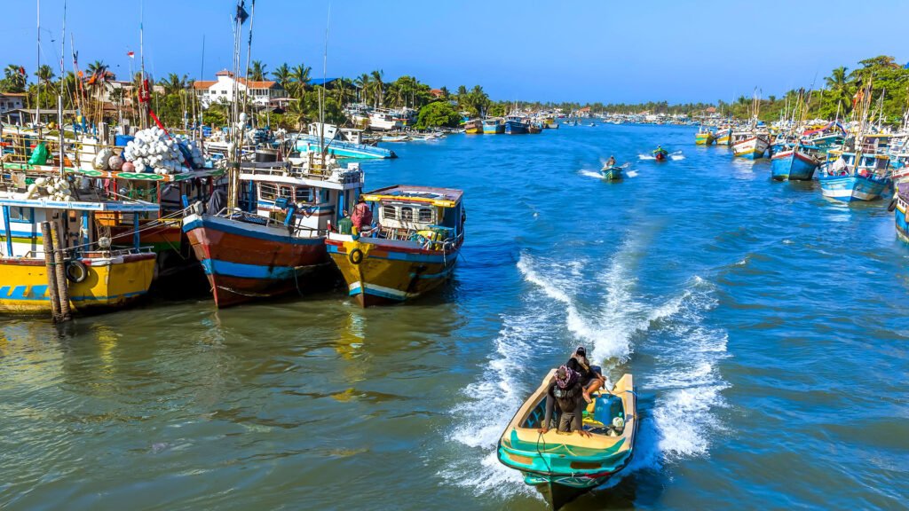 Colourful fishing boats along the busy Negombo Lagoon in Sri Lanka.
