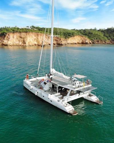 Luxury yacht sailing near Mirissa for whale watching in Sri Lanka.