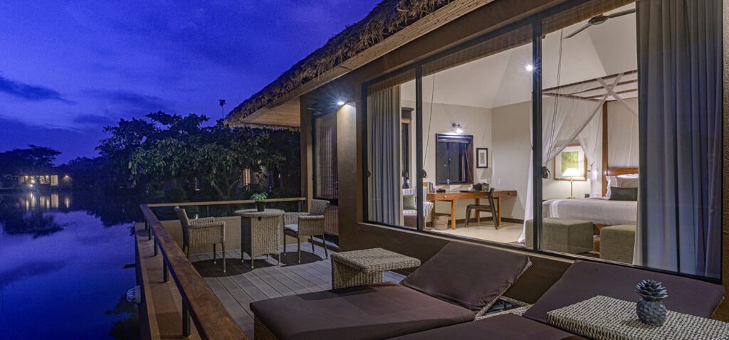 Private terrace overlooking tranquil waterways and landscaped gardens at Water Garden Sigiriya.