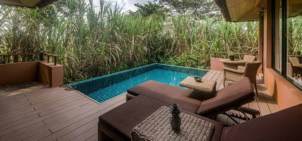 Private plunge pool and outdoor lounge at Water Garden Sigiriya surrounded by lush greenery.