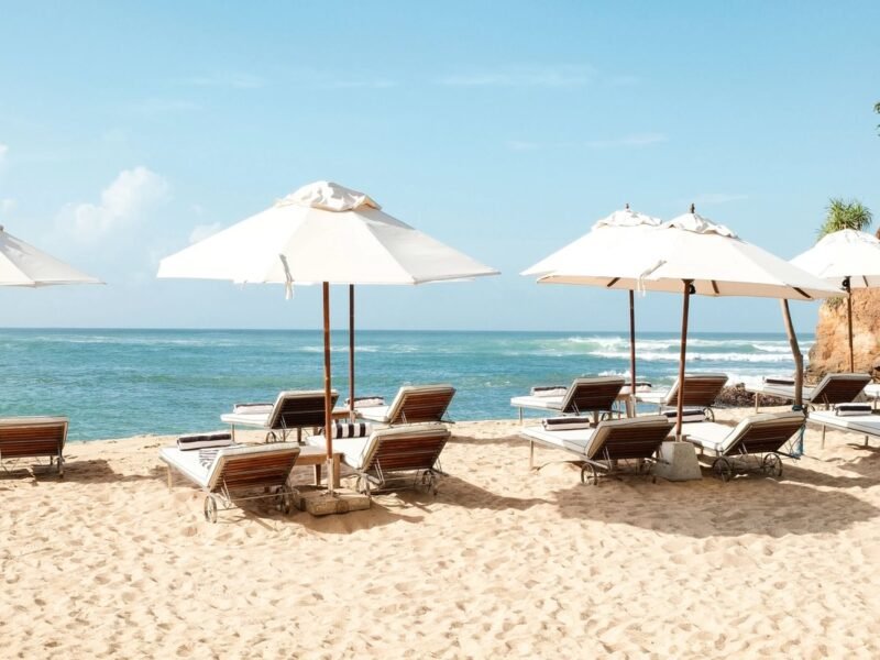 Beachfront sun loungers and parasols overlooking the Indian Ocean at Cape Weligama