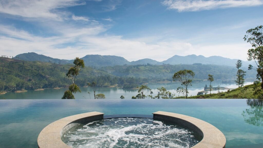 Infinity pool and jacuzzi overlooking the lake and mountains at Ceylon Tea Trails.