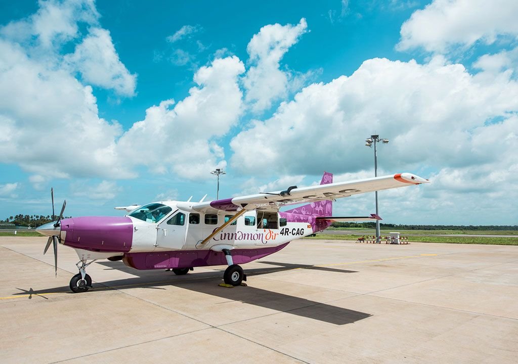 Cinnamon Air aircraft parked on the runway in Sri Lanka.