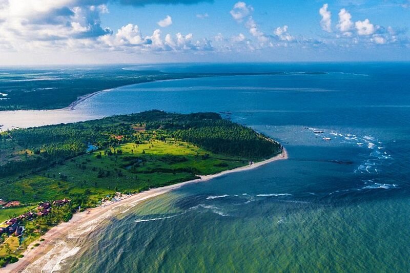 Aerial view of Passikudah’s curved coastline, lagoon and turquoise eastern waters.