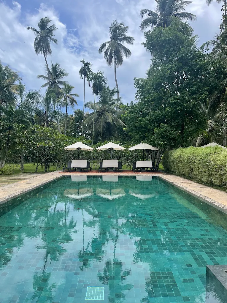 Swimming pool surrounded by tropical gardens at Uga Riva.