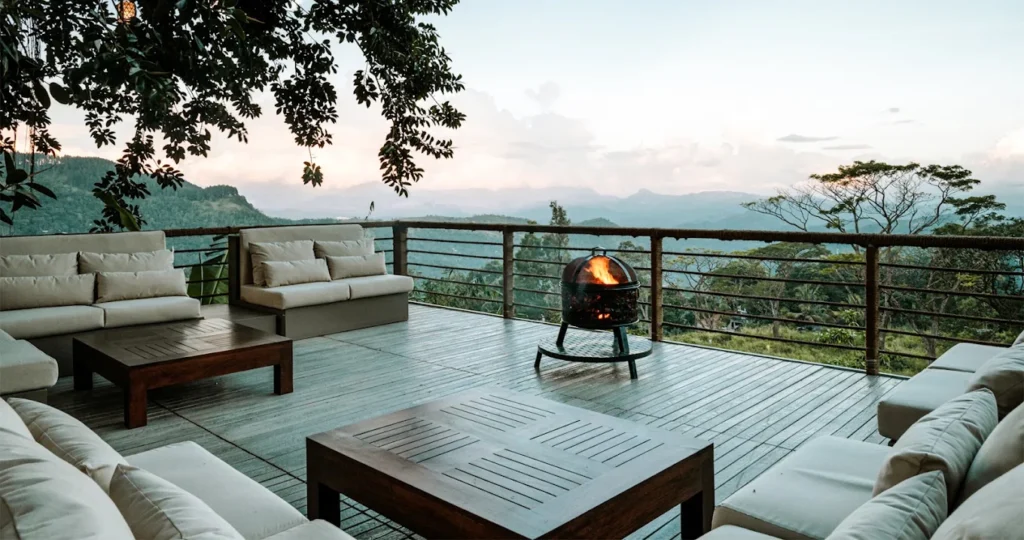 Mountain-view terrace with lounge seating and a fire pit at W15 Hanthana.