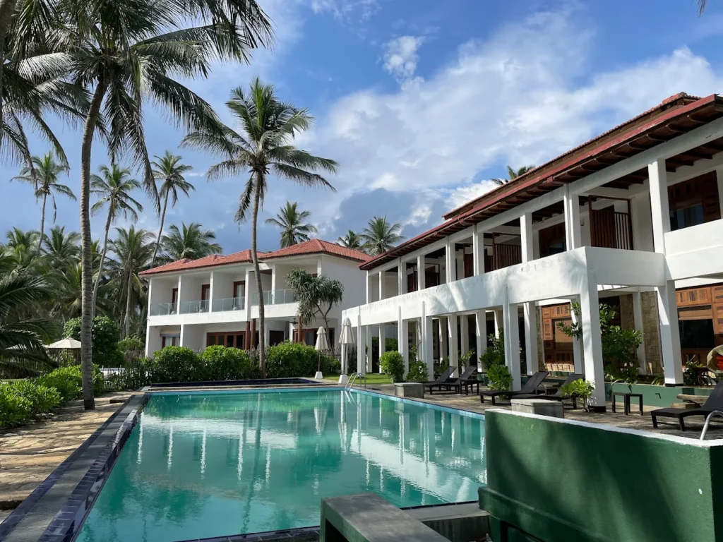 Turtle Bay Hotel surrounded by tropical gardens with a pool in Sri Lanka